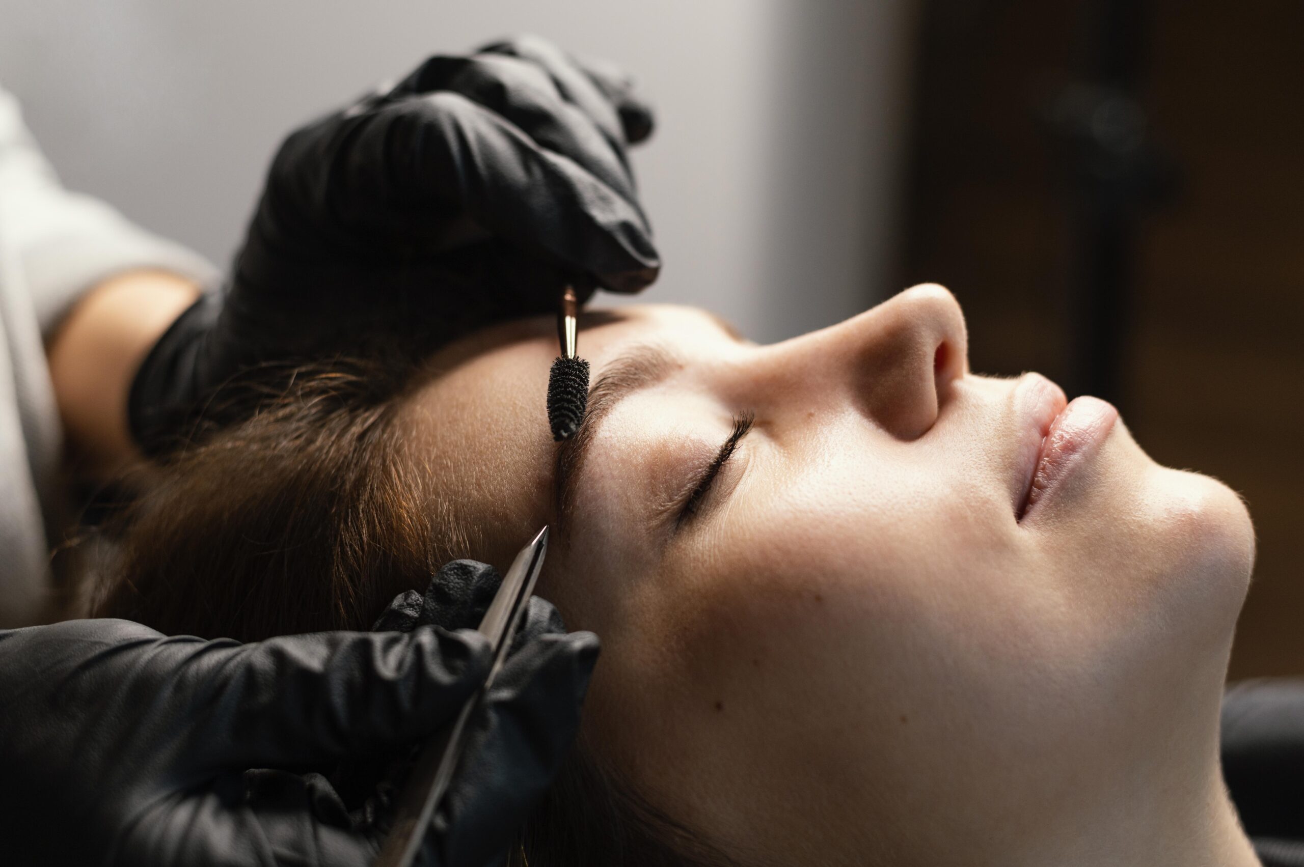 Side View Female Specialist Doing Eyebrow Treatment Woman